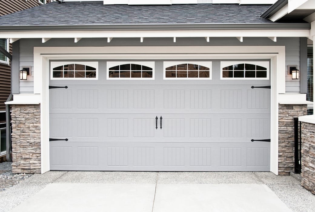 Beautiful Garage With Light Grey Color and Brick on the Sides