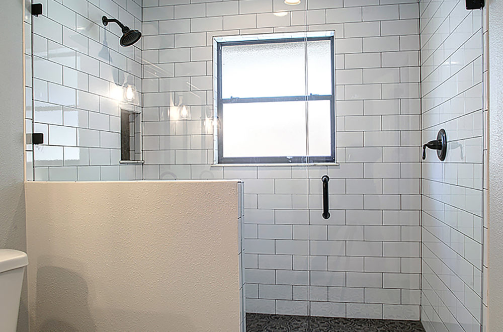 White Bathroom with Bright Modern Window Inside the Shower